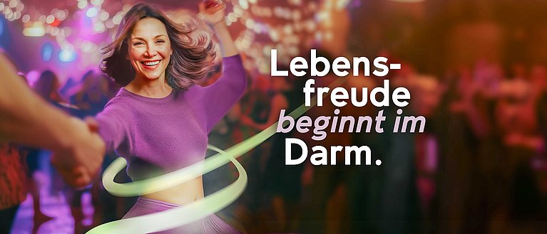 Hier sieht man das Keyvisual von MYRRHINIL-INTEST, eine tanzende Frau - Lebensfreude beginnt im Darm